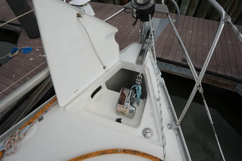 Slide: The Image of Bow of a 2007 Bavaria 37 C sailboat with anchor chain and deck details. - 7