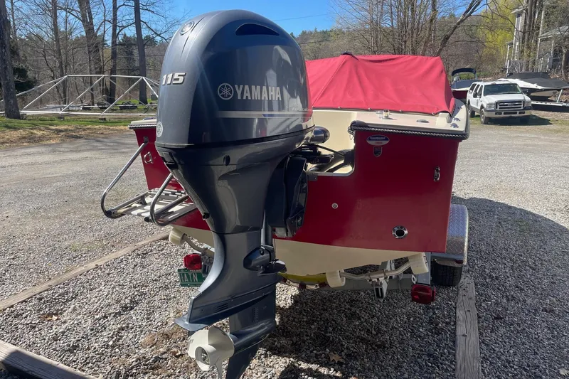 Slide: The Image of 2018 Rossiter 17 Closed Deck boat with Yamaha 115 outboard motor, parked on gravel. - 19