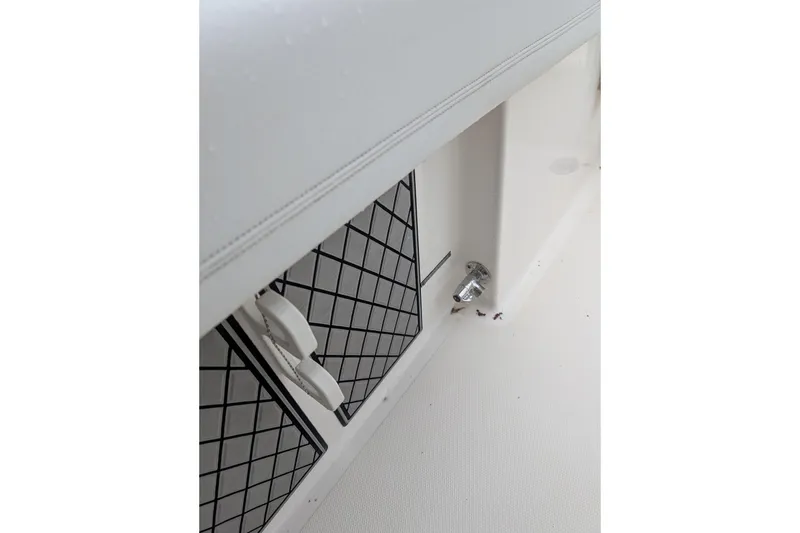 Slide: The Image of 2019 Wellcraft 222 Fisherman boat interior detail with storage compartments. - 13