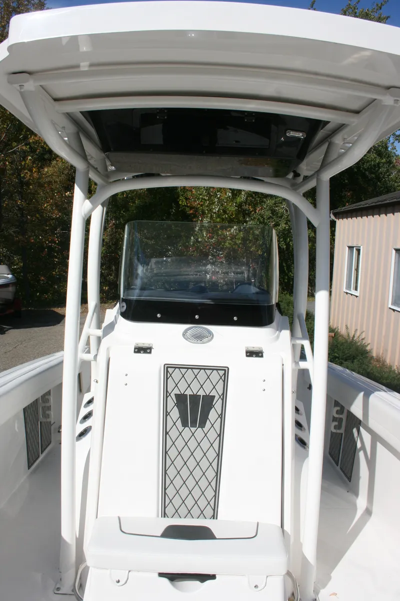 Slide: The Image of 2019 Wellcraft 222 Fisherman boat with helm and canopy. - 2