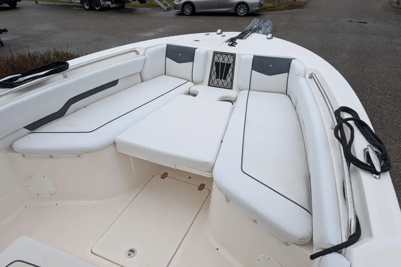 Slide: The Image of 2019 Wellcraft 222 Fisherman boat interior with cushioned seating and storage compartments. - 3