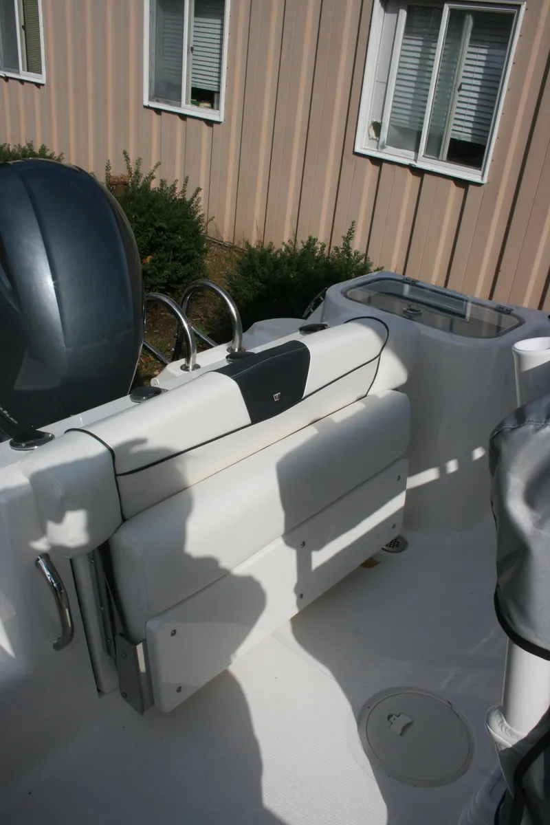 Slide: The Image of 2019 Wellcraft 222 Fisherman boat interior with seating area. - 9