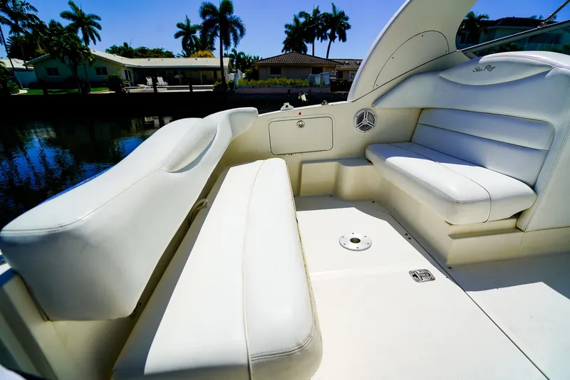 Slide: The Image of 2007 Sea Ray 280 Sundancer boat interior with white seating and waterfront view. - 11