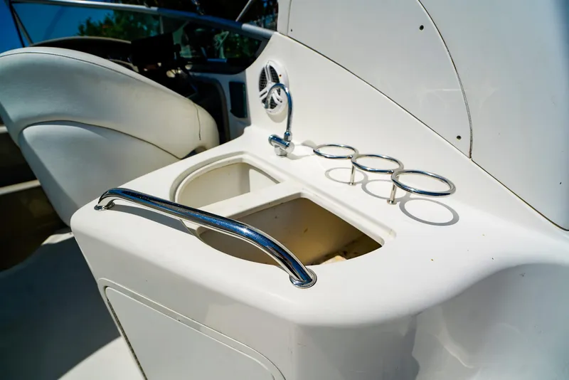 Slide: The Image of 2007 Sea Ray 280 Sundancer boat interior with sink and cup holders. - 13
