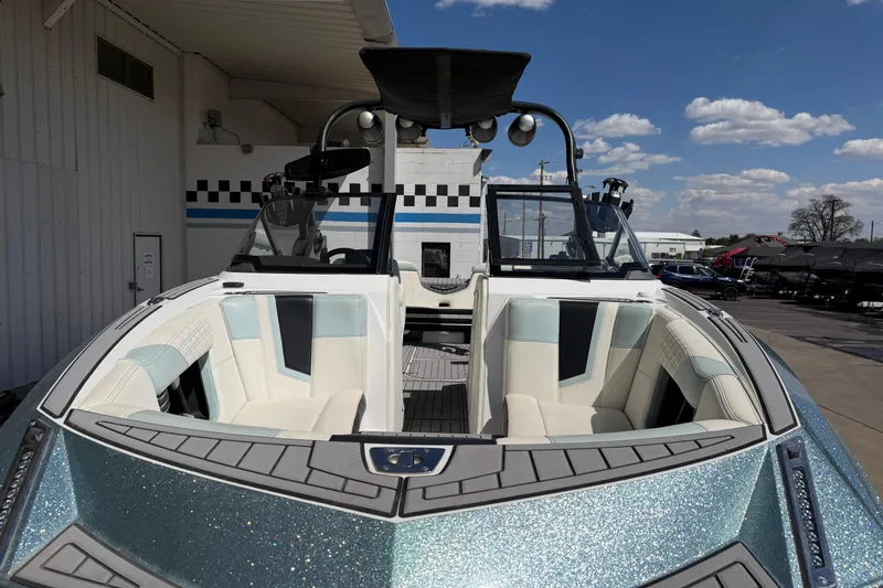Slide: The Image of 2020 Nautique Super Air Nautique G25 boat with sleek design and spacious seating. - 10