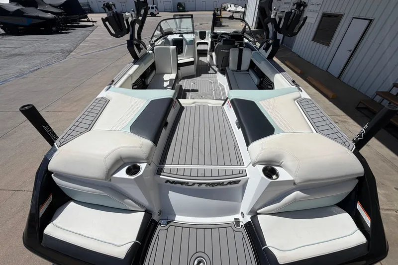 Slide: The Image of 2020 Nautique Super Air Nautique G25 boat interior with spacious seating and sleek design. - 11