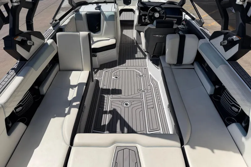 Slide: The Image of 2020 Nautique Super Air Nautique G25 interior with luxurious seating and modern design. - 12