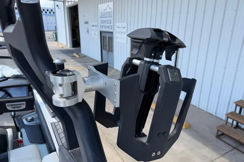 Slide: The Image of Wakeboard rack on a 2020 Nautique Super Air Nautique G25 boat, near service entrance. - 20