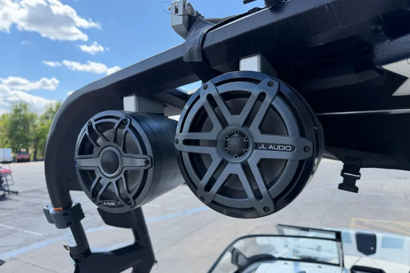 Slide: The Image of JL Audio speakers on 2020 Nautique Super Air Nautique G25 boat, under clear sky. - 21