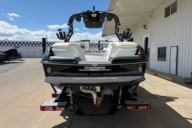 Slide: The Image of 2020 Nautique Super Air Nautique G25 boat, rear view, parked outdoors. - 4