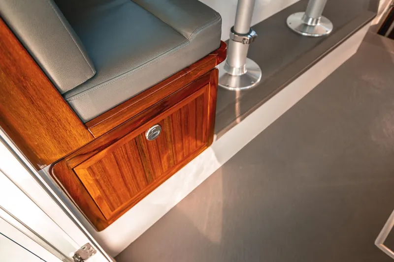 Slide: The Image of Interior of 2019 Lindell 46' boat with wooden cabinetry and cushioned seating. - 11