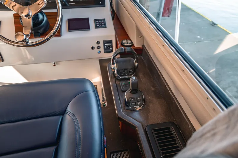 Slide: The Image of Interior of a 2019 Lindell 46' yacht showing steering and control panel. - 17