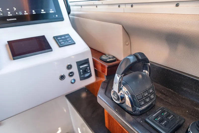 Slide: The Image of Control panel of a 2019 Lindell 46' yacht with navigation equipment. - 18