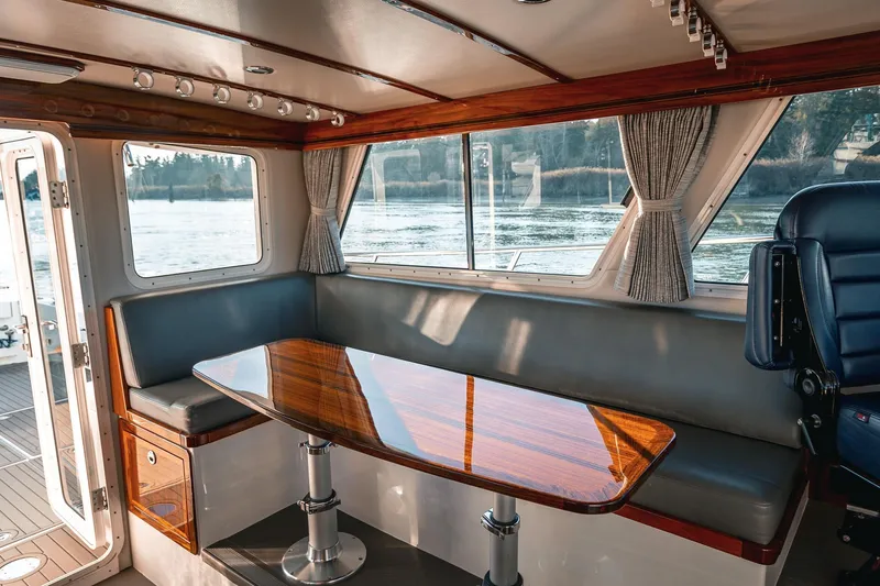 Slide: The Image of Luxurious interior of 2019 Lindell 46' yacht with elegant seating and polished wood table. - 19
