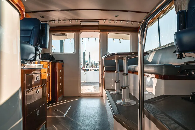 Slide: The Image of Interior of 2019 Lindell 46' yacht with luxurious seating and wooden cabinetry. - 20