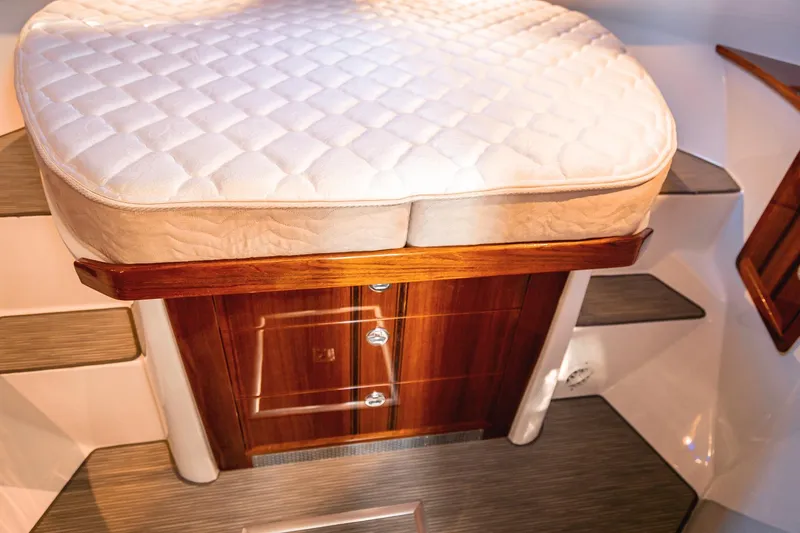 Slide: The Image of Luxurious cabin interior of 2019 Lindell 46' yacht with cushioned seating and wooden accents. - 25