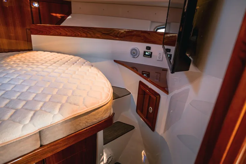 Slide: The Image of Luxurious cabin interior of a 2019 Lindell 46' yacht with cozy bedding and modern amenities. - 27