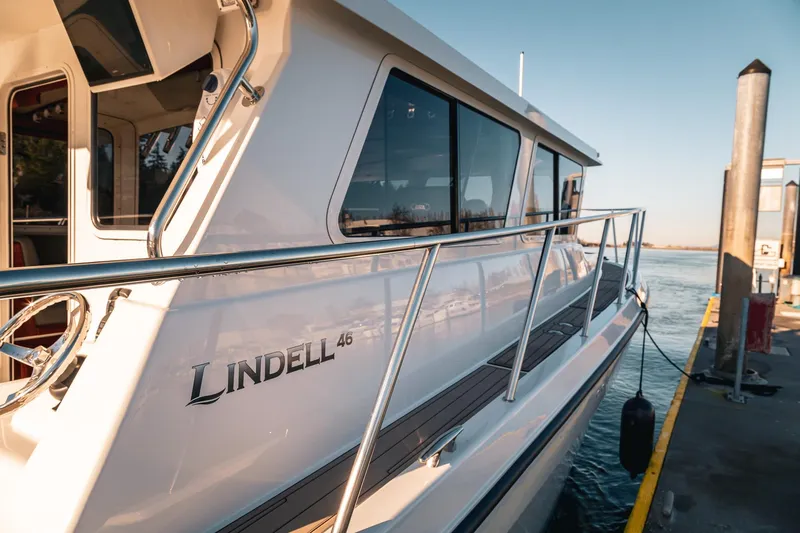 Slide: The Image of 2019 Lindell 46' yacht docked, showcasing sleek design and modern features. - 3