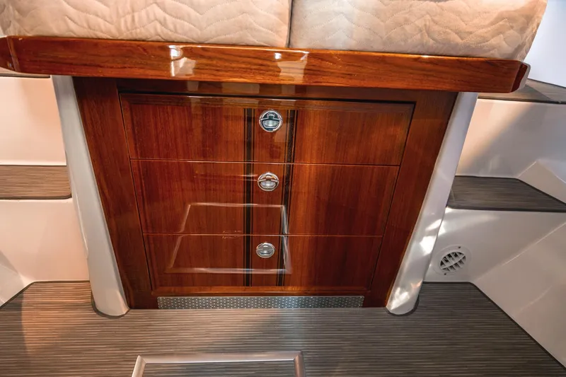 Slide: The Image of Luxurious wooden cabinetry inside a 2019 Lindell 46' yacht, featuring sleek design and craftsmanship. - 30