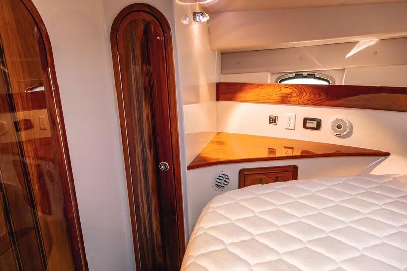 Slide: The Image of Luxurious 2019 Lindell 46' yacht interior with polished wood accents and modern amenities. - 31