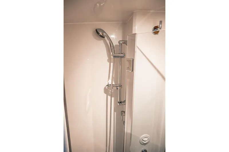 Slide: The Image of Modern shower in 2019 Lindell 46' yacht bathroom, featuring sleek chrome fixtures. - 37