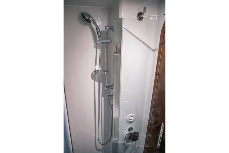 Slide: The Image of Modern shower in 2019 Lindell 46' yacht, featuring sleek chrome fixtures and glass door. - 38