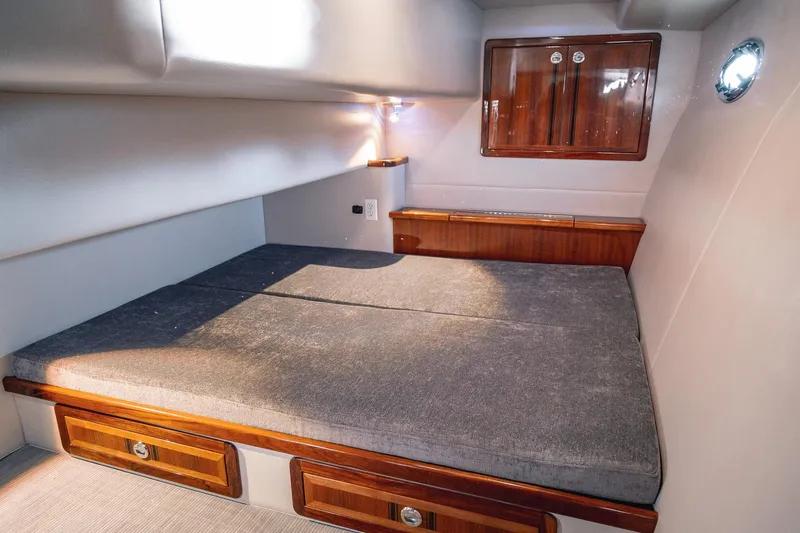 Slide: The Image of Cozy cabin interior of 2019 Lindell 46' yacht with wooden accents and soft lighting. - 41