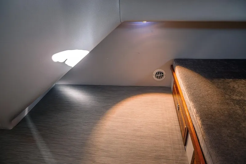 Slide: The Image of Cozy interior of 2019 Lindell 46' yacht with soft lighting and wooden accents. - 42