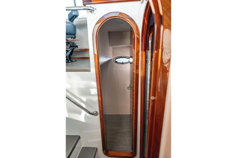 Slide: The Image of Interior of 2019 Lindell 46' yacht with wooden trim and porthole window. - 45