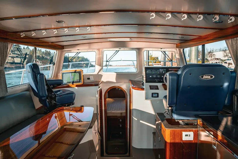 Slide: The Image of Luxurious interior of a 2019 Lindell 46' yacht with polished wood and modern navigation equipment. - 5