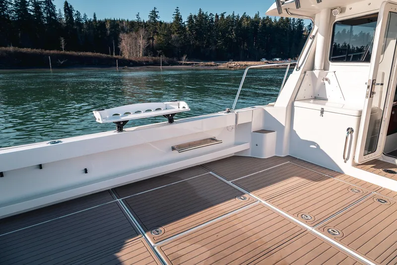 Slide: The Image of Spacious deck of 2019 Lindell 46' boat with scenic water view. - 53