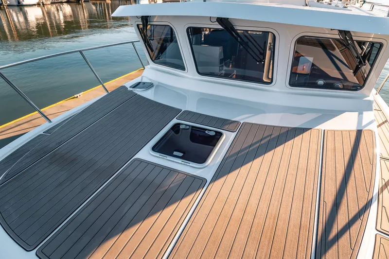 Slide: The Image of 2019 Lindell 46' yacht deck with sleek design and modern windows. - 61