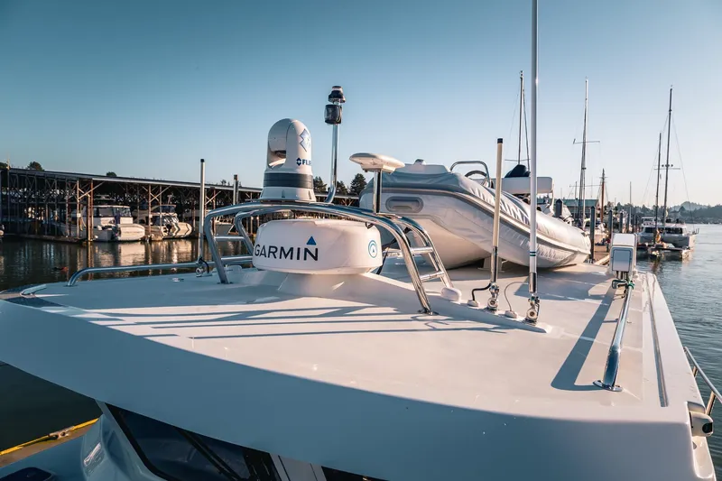 Slide: The Image of 2019 Lindell 46' yacht with Garmin equipment docked at marina. - 62