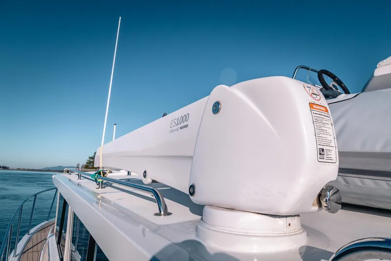 Slide: The Image of 2019 Lindell 46' yacht deck with marine equipment under clear blue sky. - 63