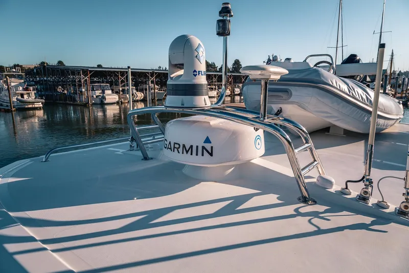 Slide: The Image of 2019 Lindell 46' yacht with Garmin and FLIR equipment docked at marina. - 64