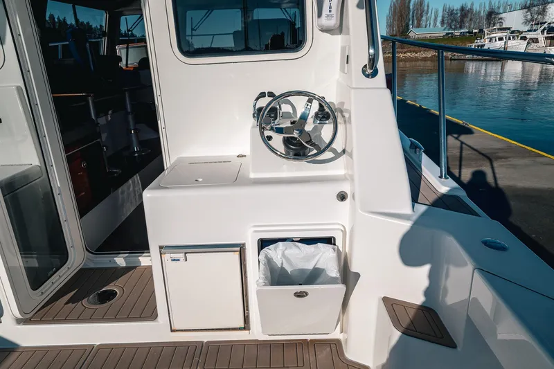 Slide: The Image of 2019 Lindell 46' yacht helm station with sleek design and modern controls. - 72
