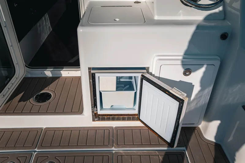 Slide: The Image of Open refrigerator on 2019 Lindell 46' yacht deck, showcasing modern marine amenities. - 73