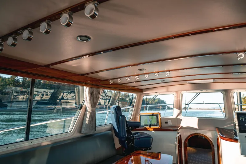 Slide: The Image of Interior of 2019 Lindell 46' yacht with panoramic windows and modern navigation equipment. - 8
