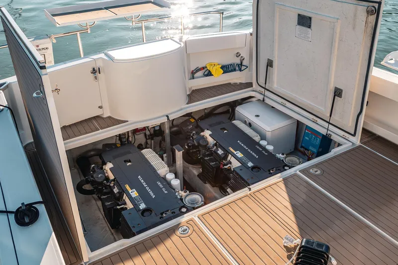 Slide: The Image of Engine compartment of a 2019 Lindell 46' boat with twin Volvo Penta engines. - 80