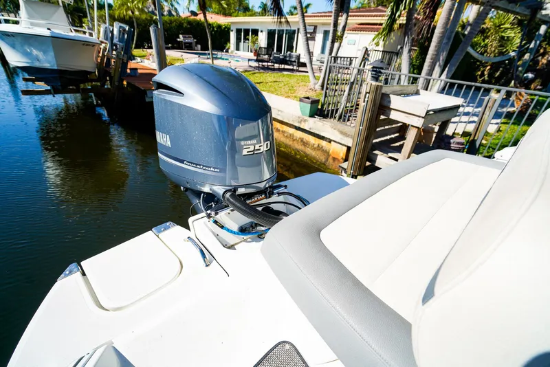 Slide: The Image of 2019 Cobalt 23SC boat with Yamaha 250 engine docked by waterfront home. - 9