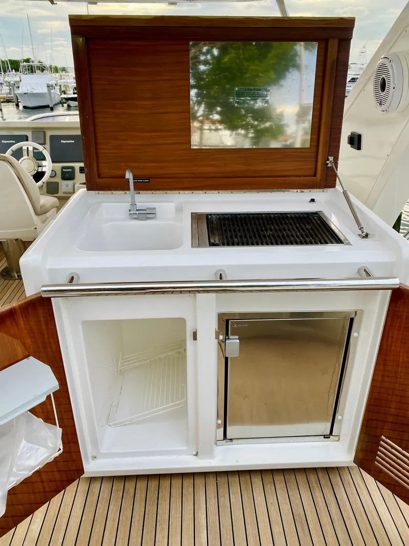 Slide: The Image of Outdoor kitchen on 2015 Azimut 50 yacht with sink, grill, and fridge. - 17