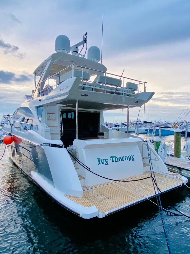 Slide: The Image of Azimut 50 yacht, 2015 model, docked at marina during sunset. - 3
