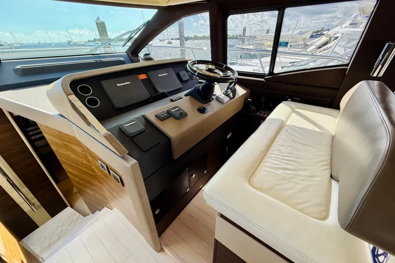 Slide: The Image of Interior helm of 2015 Azimut 50 yacht with modern controls and leather seating. - 39