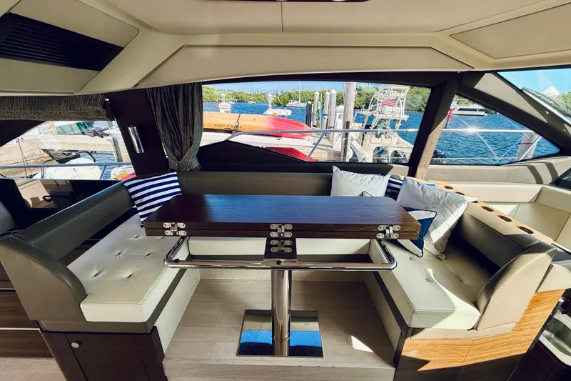 Slide: The Image of Luxurious interior of 2015 Azimut 50 yacht with elegant seating and scenic marina view. - 42