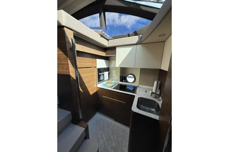 Slide: The Image of Luxurious interior of 2015 Azimut 50 yacht kitchen with modern amenities. - 52