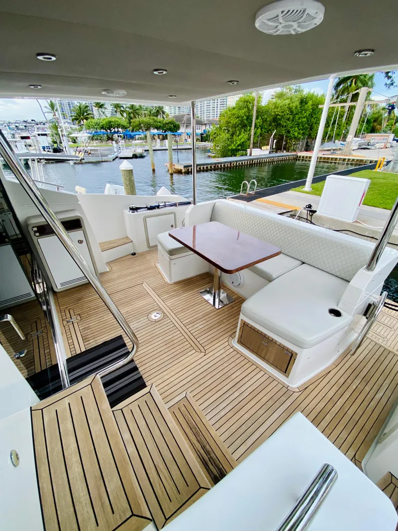 Slide: The Image of Luxurious 2015 Azimut 50 yacht with spacious teak deck and elegant seating area. - 6