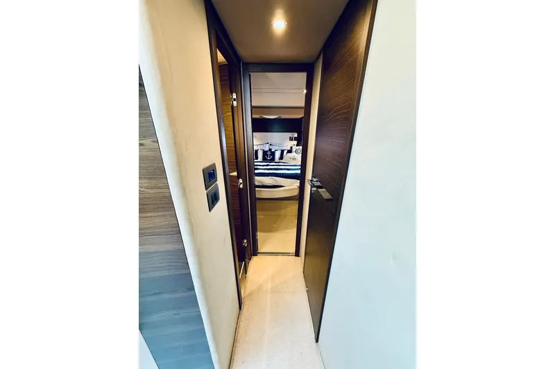 Slide: The Image of Hallway leading to a bedroom in a 2015 Azimut 50 yacht. - 60