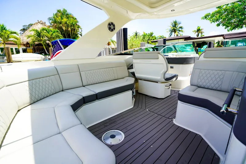 Slide: The Image of 2022 Sea Ray SLX 310 OB boat interior with luxurious seating and modern design. - 15
