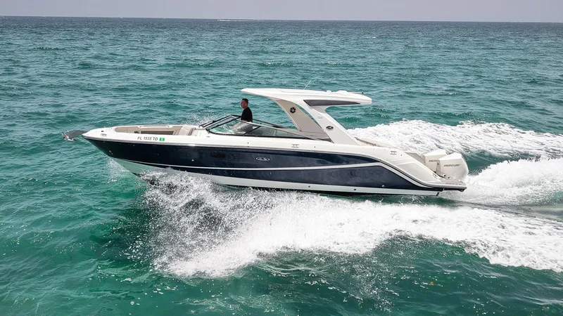 Slide: The Image of 2022 Sea Ray SLX 310 Outboard cruising on open water. - 3