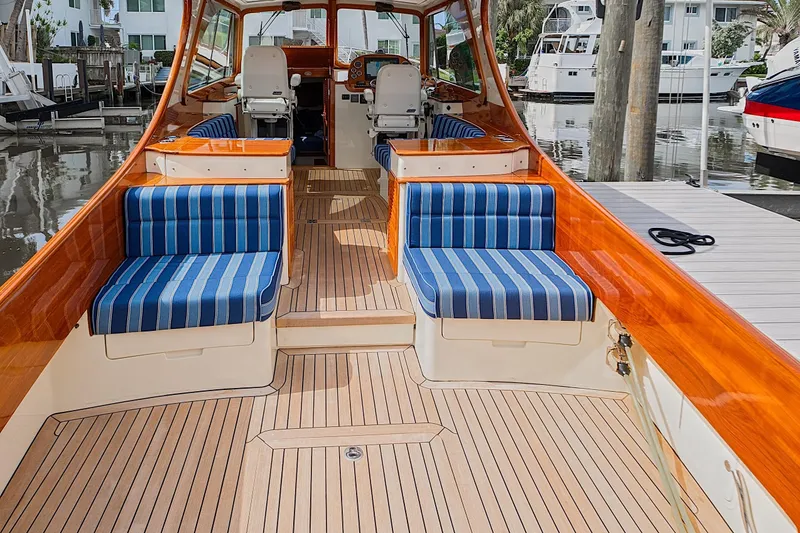 Slide: The Image of 2018 Hinckley Picnic Boat 37 MKIII with striped seating and polished wood interior. - 27